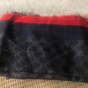 Brand new (no tags) Gucci scarf. Black with red trim. Silk